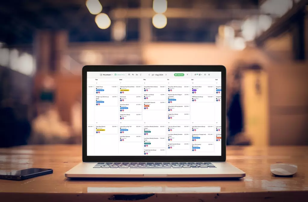 A shared social media content calendar on a laptop