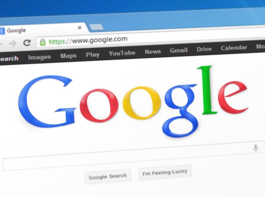 Google search homepage open in a browser on a laptop